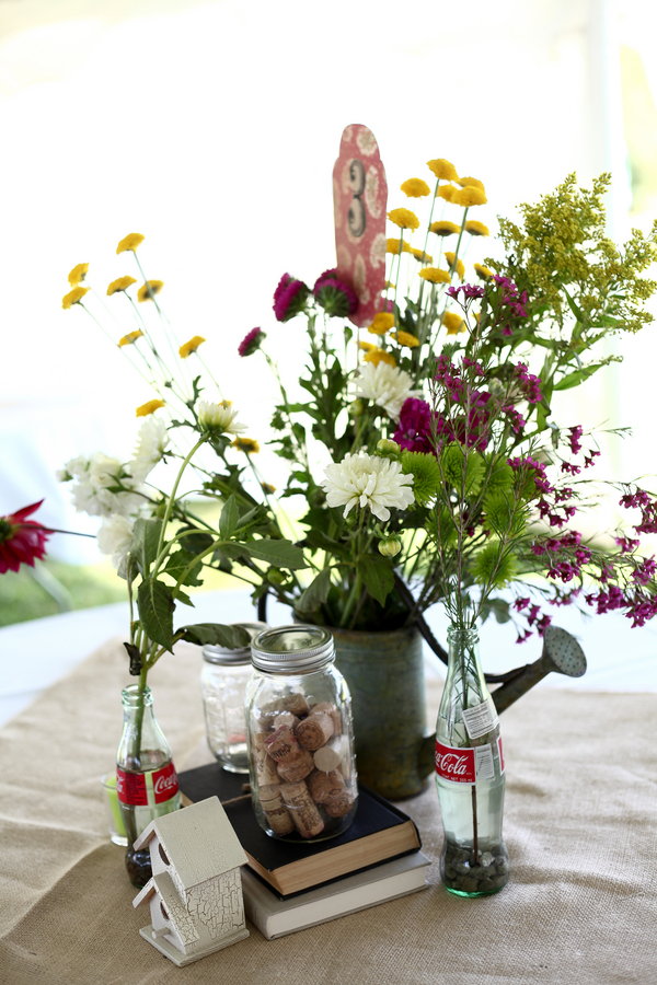 centerpieces using canisters she had collected throughout her engagement