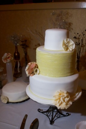 white-and-yellow-wedding-cake-with-fabric-flowers